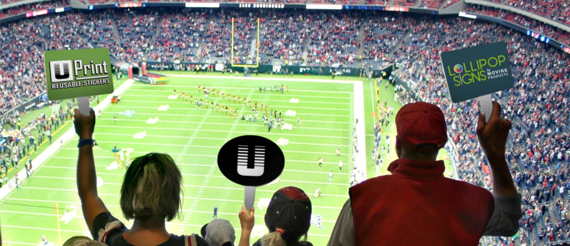 group of people holding a sign inside of a stadium 