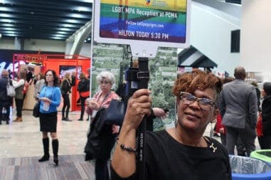 Woman holding a sign