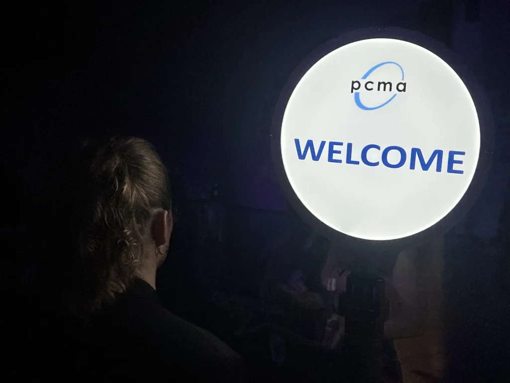 Lollipop Signs LED welcome greeter sign at a PCMA event