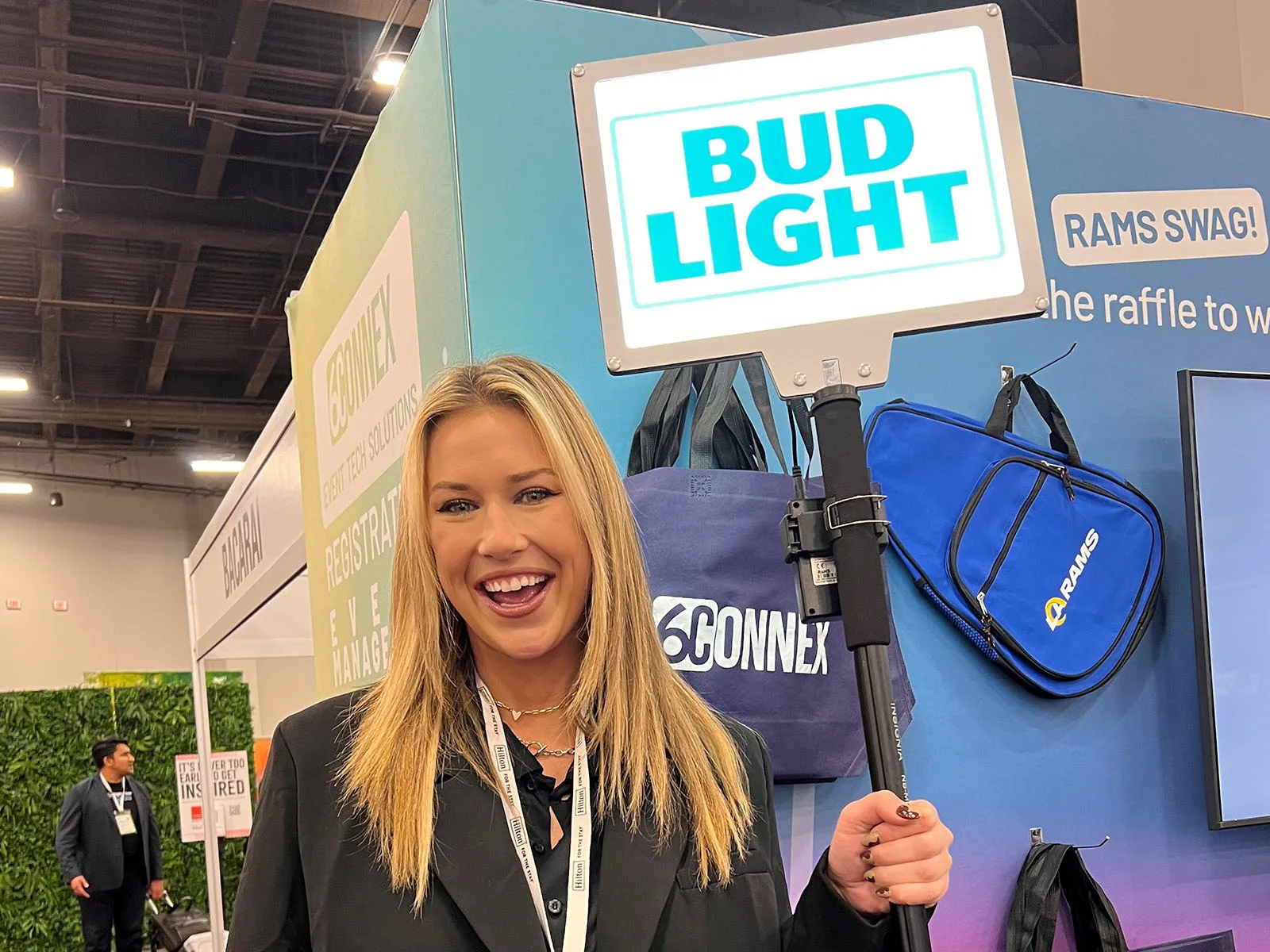 Lollipop Signs rectangular LED sign at a sponsor brand activation at an event tech trade show