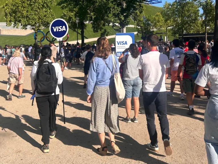 Lollipop Signs hand-held sign guiding spectators through the Olympic park at the Paris 2024 Olympics